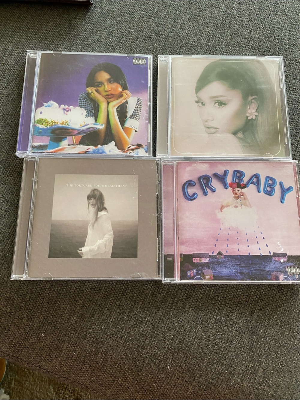 4 CD’s - Olivia Rodrigo. Ariana Grande, Taylor Swift, and Melanie Martinez